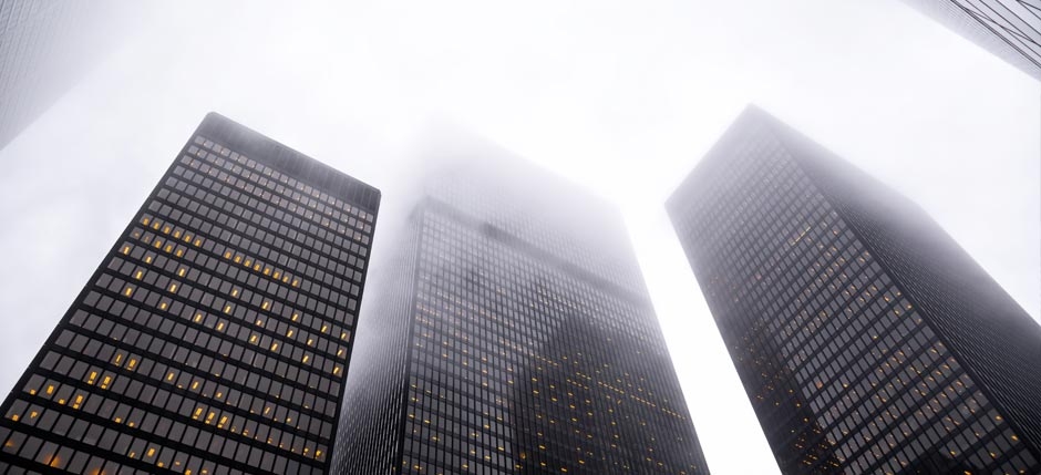 Skyscrapers being blanketed by fog