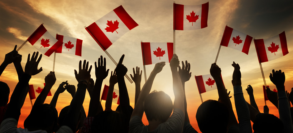 Canadians celebrating and raising the Maple Leaf flag