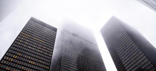Skyscrapers being blanketed by fog