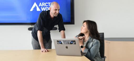 Colleagues collaborating in an Arctic Wolf boardroom